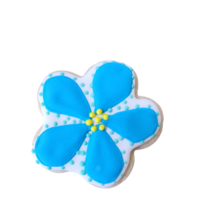 Bright blue flower sugar cookie with white petal outlines and a yellow royal icing center.