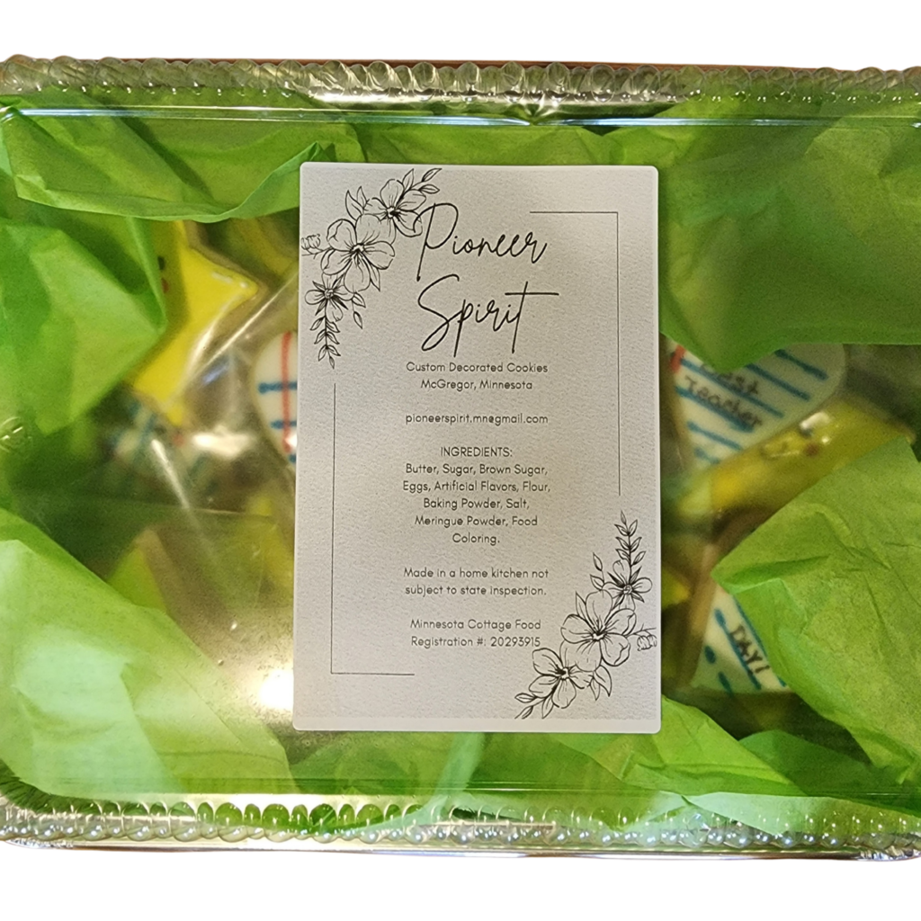 Product label for Pioneer Spirit artisanal cookies featuring floral line art and brand information.